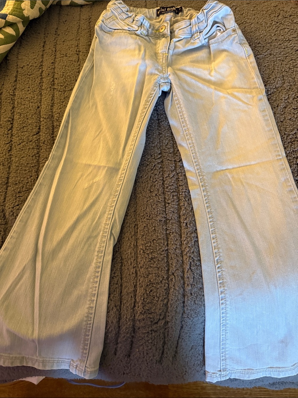 Mini Boden Light Blue Flared Jeans, slightly distressed with rainbow pockets.